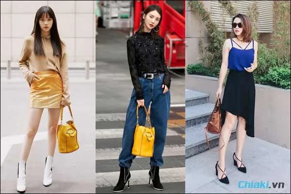 tạo d&aacute;ng chụp ảnh với t&uacute;i x&aacute;ch cầm một tay