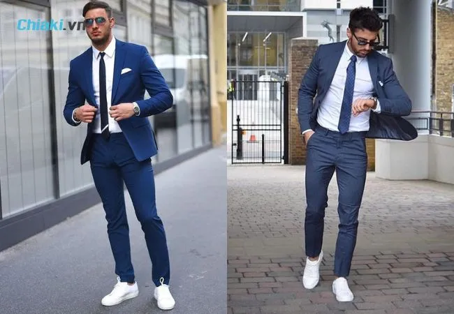 Gi&agrave;y thể thao c&ugrave;ng m&agrave;u với vest m&agrave;u xanh navy khiến tổng thể trang phục tr&ocirc;ng hiện đại hơn
