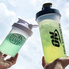 Bình lắc Optimum Nutrition 1200ml - Dụng cụ thể thao tiện lợi cho gym, chạy bộ, và hoạt động ngoài trời, chất liệu an toàn, không độc hại.