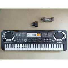 Hộp Đàn ELECTRONIC KEYBOARD kèm MIC hát có 61 phím nhạc và đèn phát sáng 6106