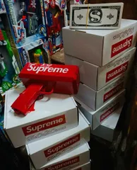 Đồ chơi giải trí súng bắn tiền Supreme The Cash Cannon gun chạy bằng pin