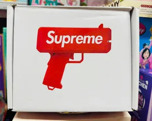 Đồ chơi giải trí súng bắn tiền Supreme The Cash Cannon gun chạy bằng pin