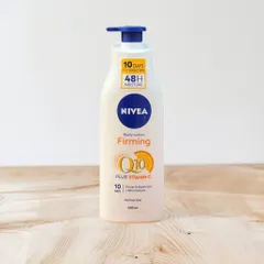 Dưỡng thể trắng da Nivea Light Body Lotion Firming Q10 + Vitamin C màu trắng cho da thường 400ml