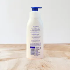 Dưỡng thể trắng da Nivea Light Body Lotion Firming Q10 + Vitamin C màu trắng cho da thường 400ml
