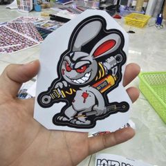 Tem Sticker Thỏ Điên Cầm Phuộc 10cm - Tem Dán 3 Lớp Cao Cấp, Chống Nước, Bảo Hành Trọn Đời, Trang Trí Ô Tô, Xe Máy, Xe Đạp