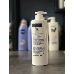 Dưỡng thể Dove Body Lotion Nourished Radiance 400ml hàng Úc