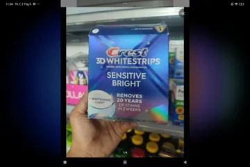 Miếng dán kèm máy chiếu làm trắng răng Crest 3D Whitestrips Sensitive Bright 28 miếng + 1 LED Light 727875