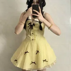 Váy sơ mi sát nách dáng xòe màu vàng phối nơ nâu phong cách công chúa