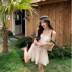 Váy hai dây màu kem trơn viền bèo dáng suông Hàn Quốc. Áo hai dây dáng dài mặc phối quần tiểu thư