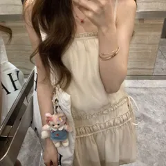 Váy hai dây màu kem trơn viền bèo dáng suông Hàn Quốc. Áo hai dây dáng dài mặc phối quần tiểu thư