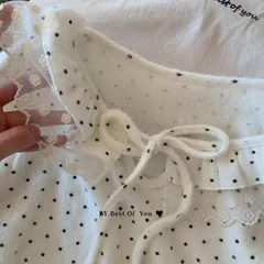 Áo mặc trong lông thỏ giữ nhiệt chấm bi lượn bèo thắt nơ. Áo mặc trong chấm bi đen trắng kem phối với áo khoác ngoài