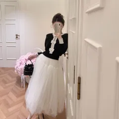 Áo len dài tay đính nơ đen trắng xinh xắn tiểu thư