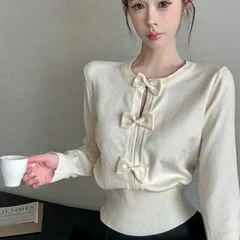 Áo len dài tay đính nơ đen trắng xinh xắn tiểu thư