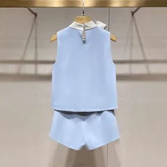 Set đồ nữ công sở áo sát nách phối nơ cổ trắng và quần đùi màu xanh biển sang trọng