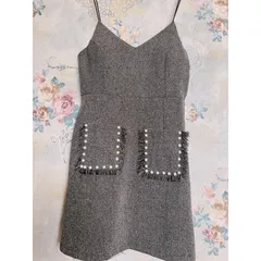 Mđầm body 2 dây có mút phối túi kết chuỗi 2 bên tua rua. Vãi bố.  Màu xám muối tiêu. Free size : từ 53kg trở xuống
