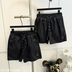 Quần đùi nam nữ thiết kế đen trơn gắn tag da  quần short gió 2 lớp hot 2026
