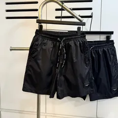 Quần đùi nam nữ thiết kế đen trơn gắn tag da  quần short gió 2 lớp hot 2026