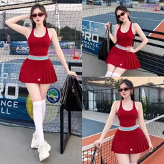 Set thể thao nữ áo ba lỗ tăm lạnh sọc màu có đệm ngực, chân váy cam kèm quần bảo hộ