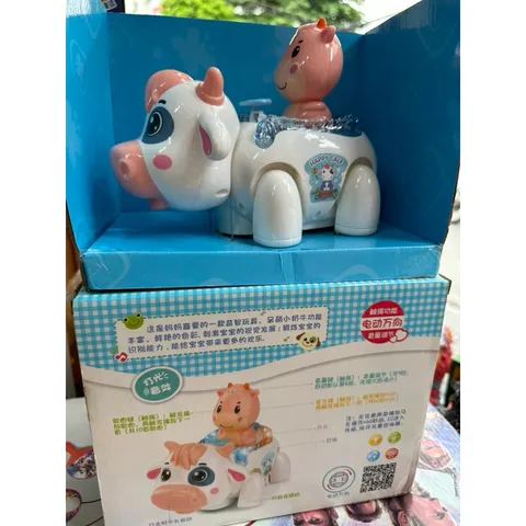 Hộp đồ chơi Bò sữa lắp pin biết đi, có nhạc và đèn phát sáng 1020 (tặng kèm pin)