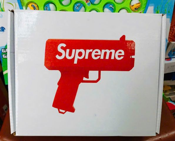 Đồ chơi giải trí súng bắn tiền Supreme The Cash Cannon gun chạy bằng pin