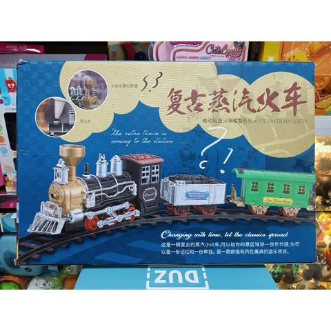 Đoàn tàu hỏa gồm 3 toa có khói chạy trên đường ray, có nhạc và đèn phát sáng 989-435 (có pin đi kèm)