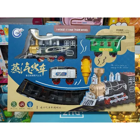 Đoàn tàu hỏa gồm 3 toa có khói chạy trên đường ray, có nhạc và đèn phát sáng 989-435 (có pin đi kèm)