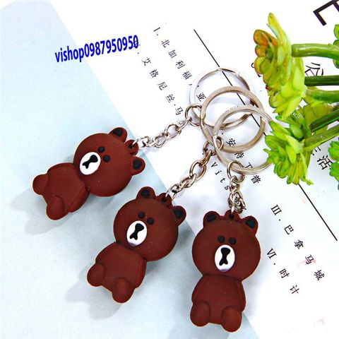 Móc Khóa Gấu Nâu Buồn Ngồi Mặc Áo Sọc - Phụ Kiện Thời Trang Dễ Thương, Quà Tặng Độc Đáo Cho Fan Gấu Brown