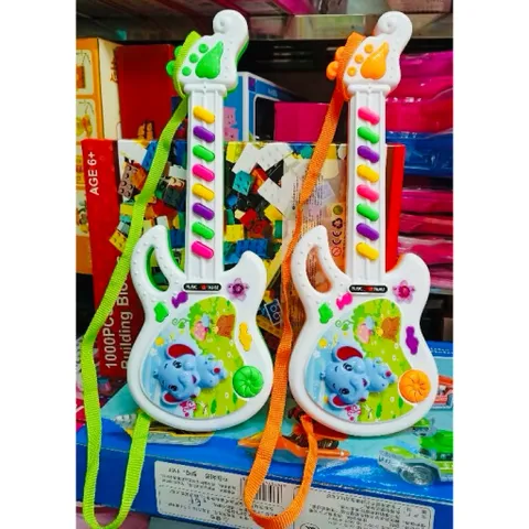 🎸 Đàn Guitar Đồ Chơi Cho Bé Có Nhạc – Guitar Mini Kèm Dây Đeo Chọn Màu Ngẫu Nhiên (Đàn guitar voi mini)