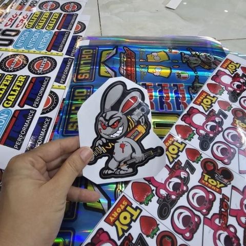 Tem sticker thỏ điên cầm phuộc OH 10cm trang trí xe máy, điện thoại, laptop
