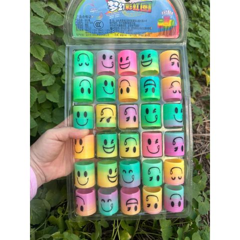 Đồ chơi nhựa Lò xo cầu vồng ma thuật mini hình mặt cười siêu cute