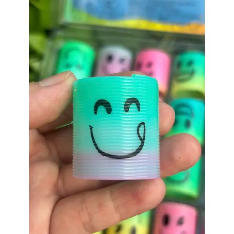 Đồ chơi nhựa Lò xo cầu vồng ma thuật mini hình mặt cười siêu cute