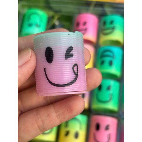 Đồ chơi nhựa Lò xo cầu vồng ma thuật mini hình mặt cười siêu cute