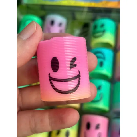 Đồ chơi nhựa Lò xo cầu vồng ma thuật mini hình mặt cười siêu cute
