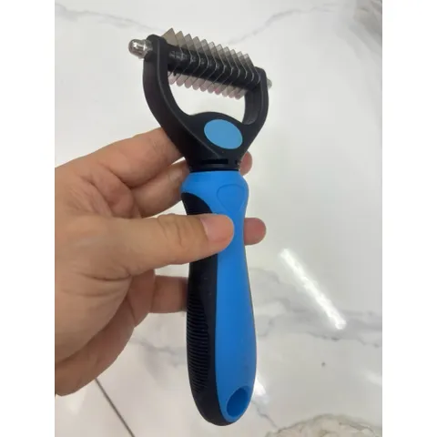 Lược gỡ rối lông cho chó mèo và thứ lớn