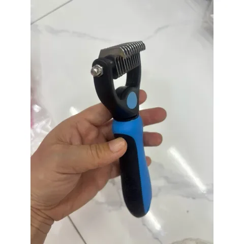 Lược gỡ rối lông cho chó mèo và thứ lớn
