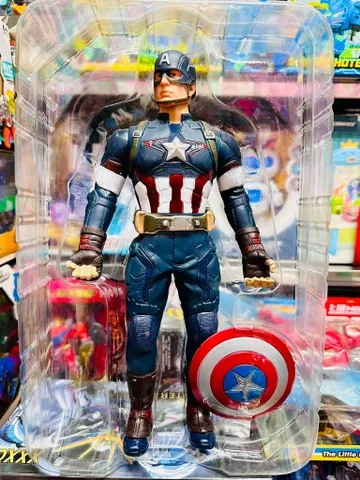 Đồ chơi Captain America với khiên tròn, bộ đồ màu xanh đỏ trắng, đeo mũ và găng tay, trong hộp nhựa trong suốt. Mô hình siêu nhân đội trưởng Mĩ cao 32cm có khớp Captain America