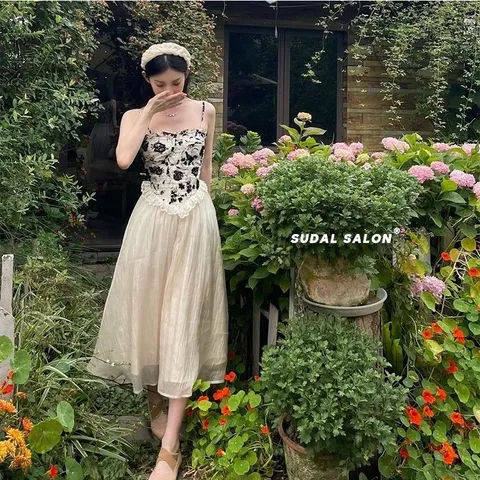 Váy hai dây đen da báo kiểu corset voan trắng
