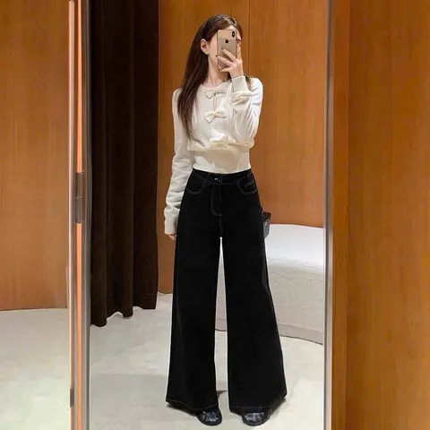 Áo len dài tay đính nơ đen trắng xinh xắn tiểu thư
