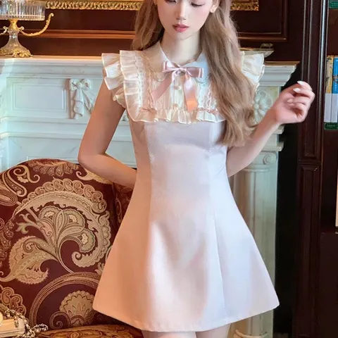 Đầm dạ hồng phấn tay bèo cổ yếm tiểu thư đính nơ