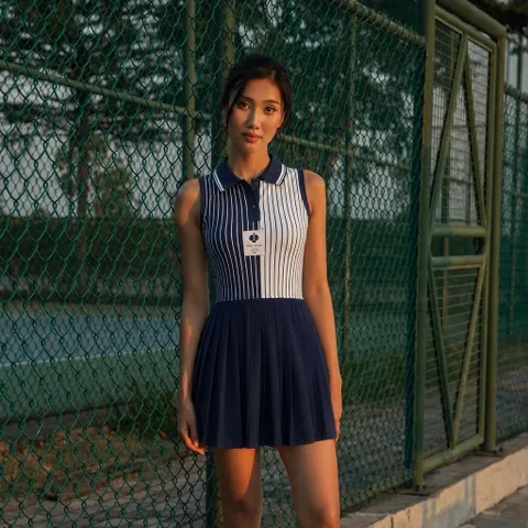 Váy polo thể thao nữ sát nách phối sọc GARNET, chân váy xếp ly, vải thun lạnh co giãn thoáng mát