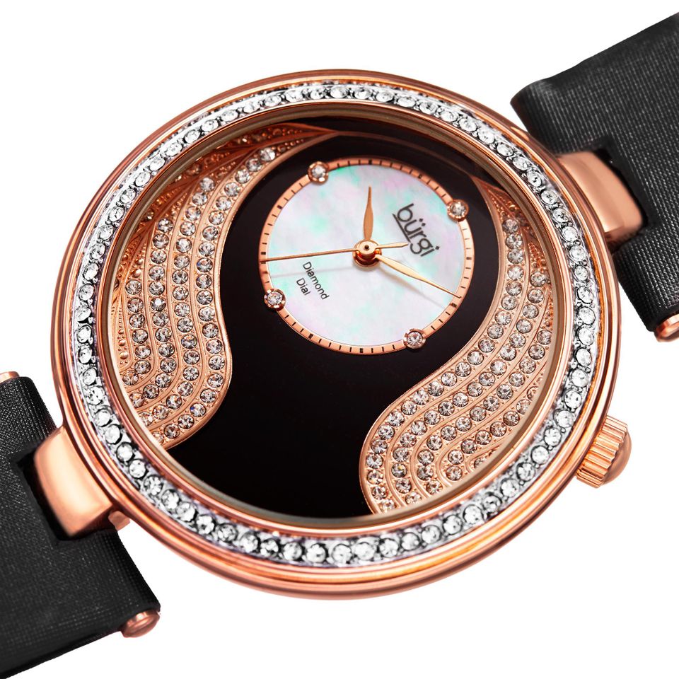 Mặt số của chiếc đồng hồ Burgi nữ này được thiết kế độc đáo với hàng trăm viên đá đính tinh xảo